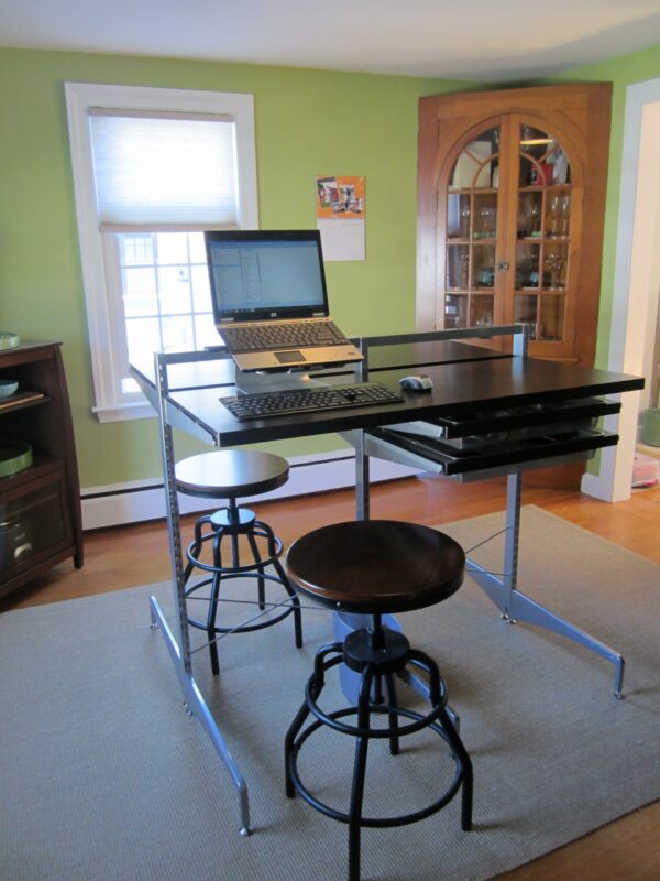 IMG_2509 dining room after transformation into home office. Standing desk and stool, with office supplies organized in the hutch.